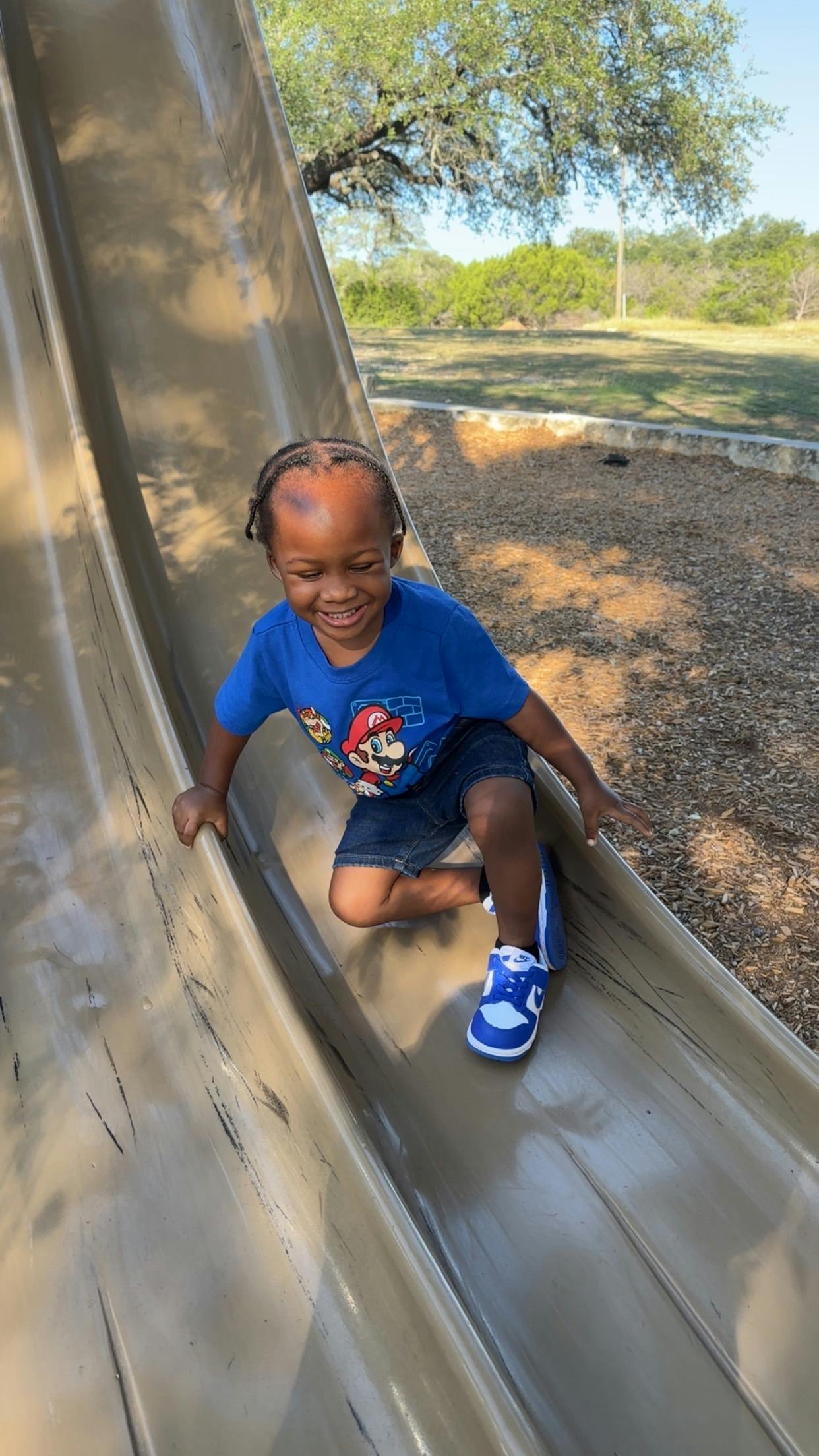 Child on a playground slide