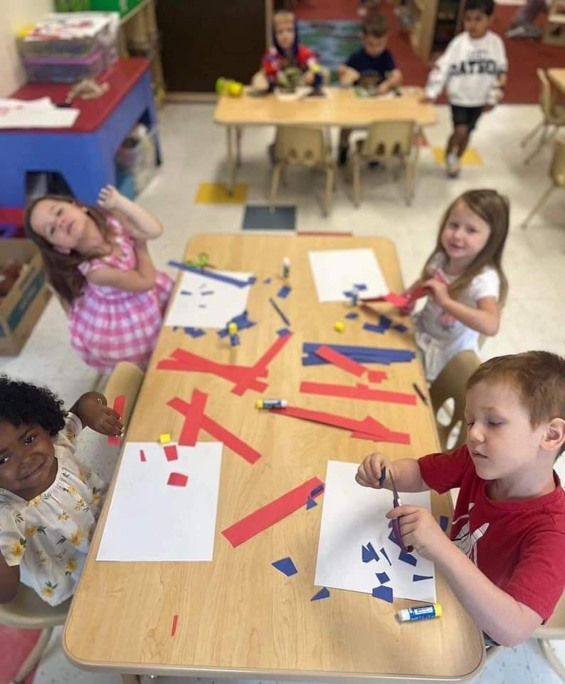 Children doing crafts at a table