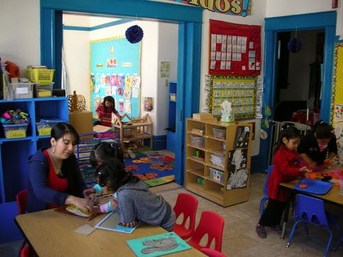 Adult and children in a classroom