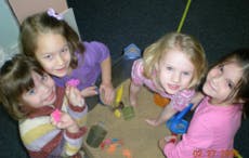 Four children looking up at the camera