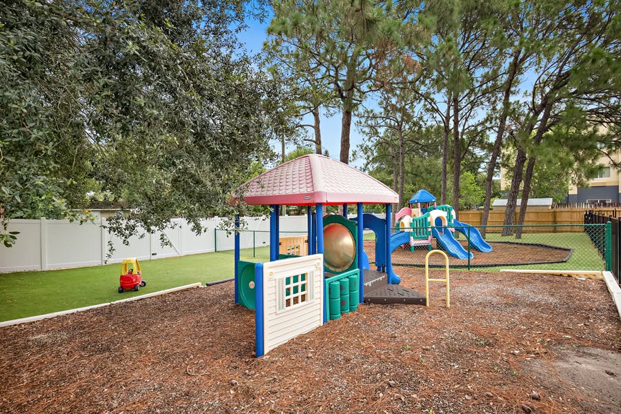 Outdoor playground with colorful play structure and slides