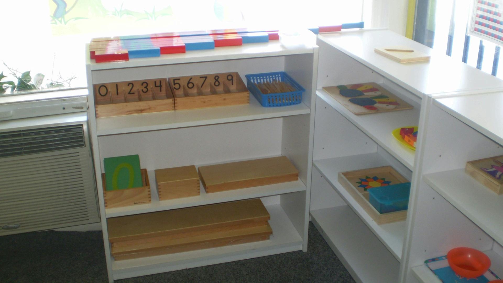 Shelves with educational materials and puzzles in a classroom