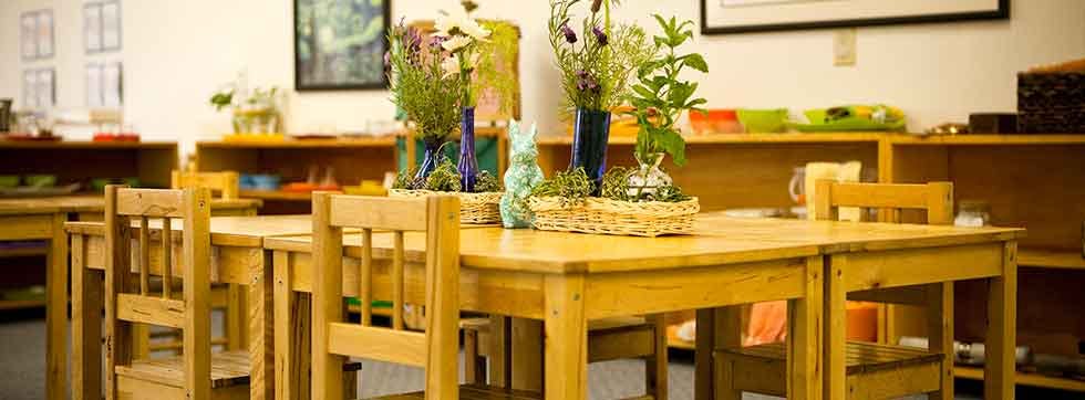 Classroom with wooden tables and chairs