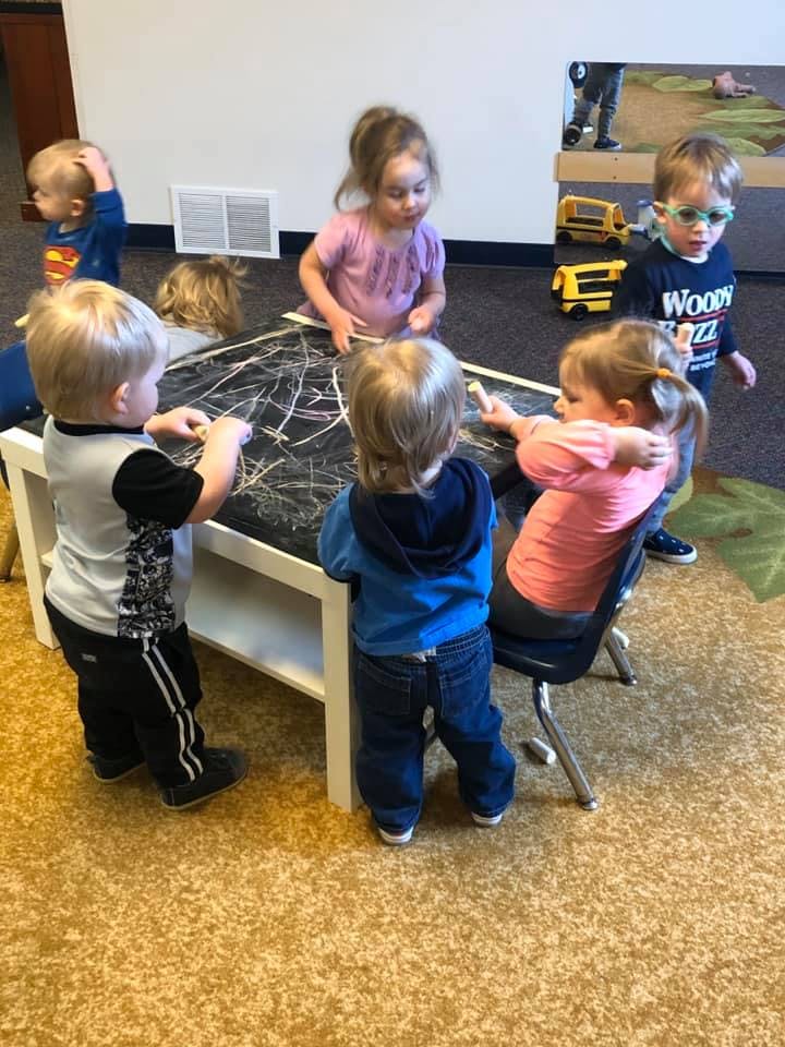 Children drawing on a table