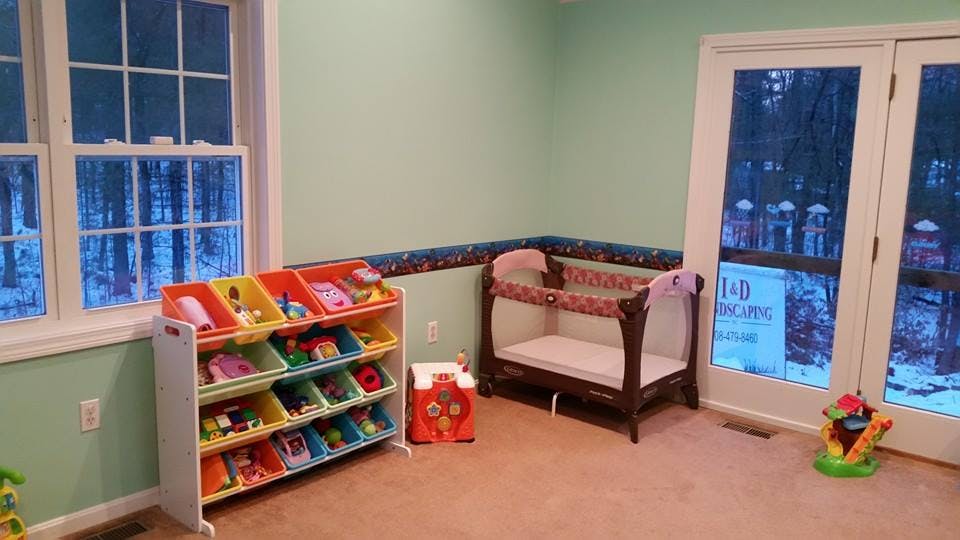 Child's room with toy organizer and crib