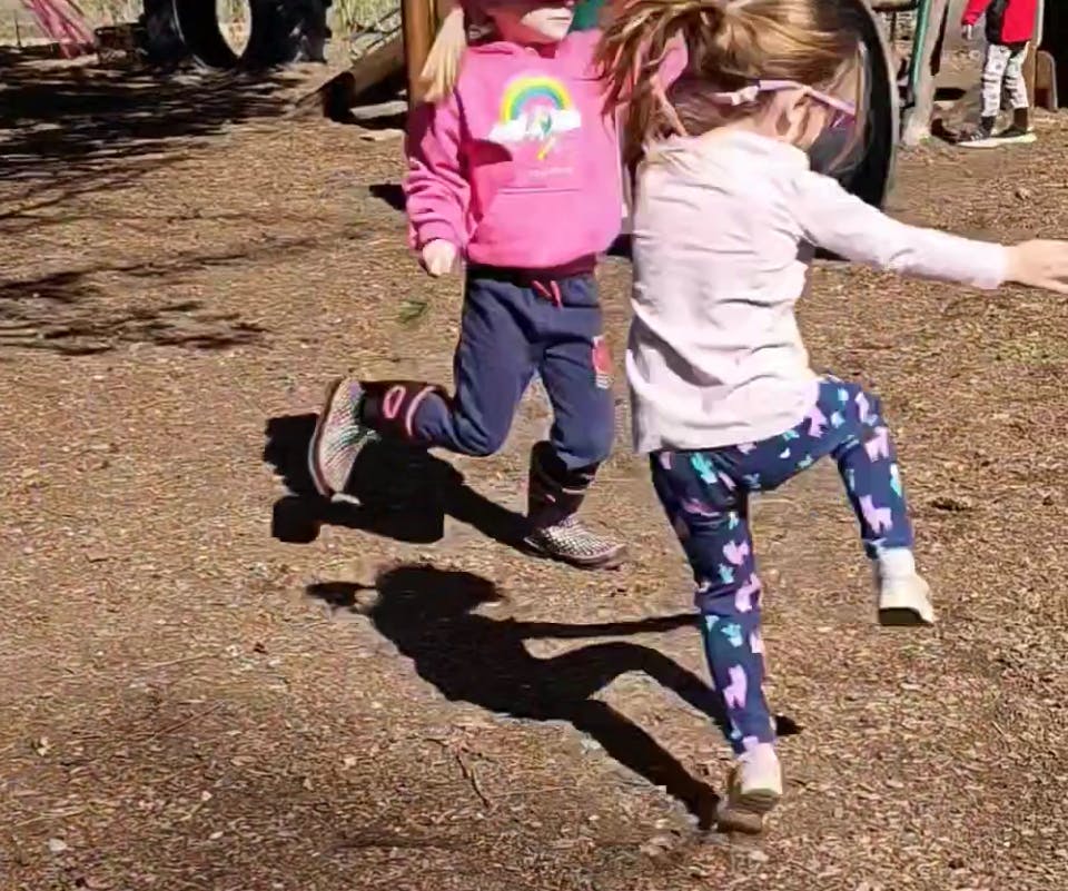 Two children playing outdoors