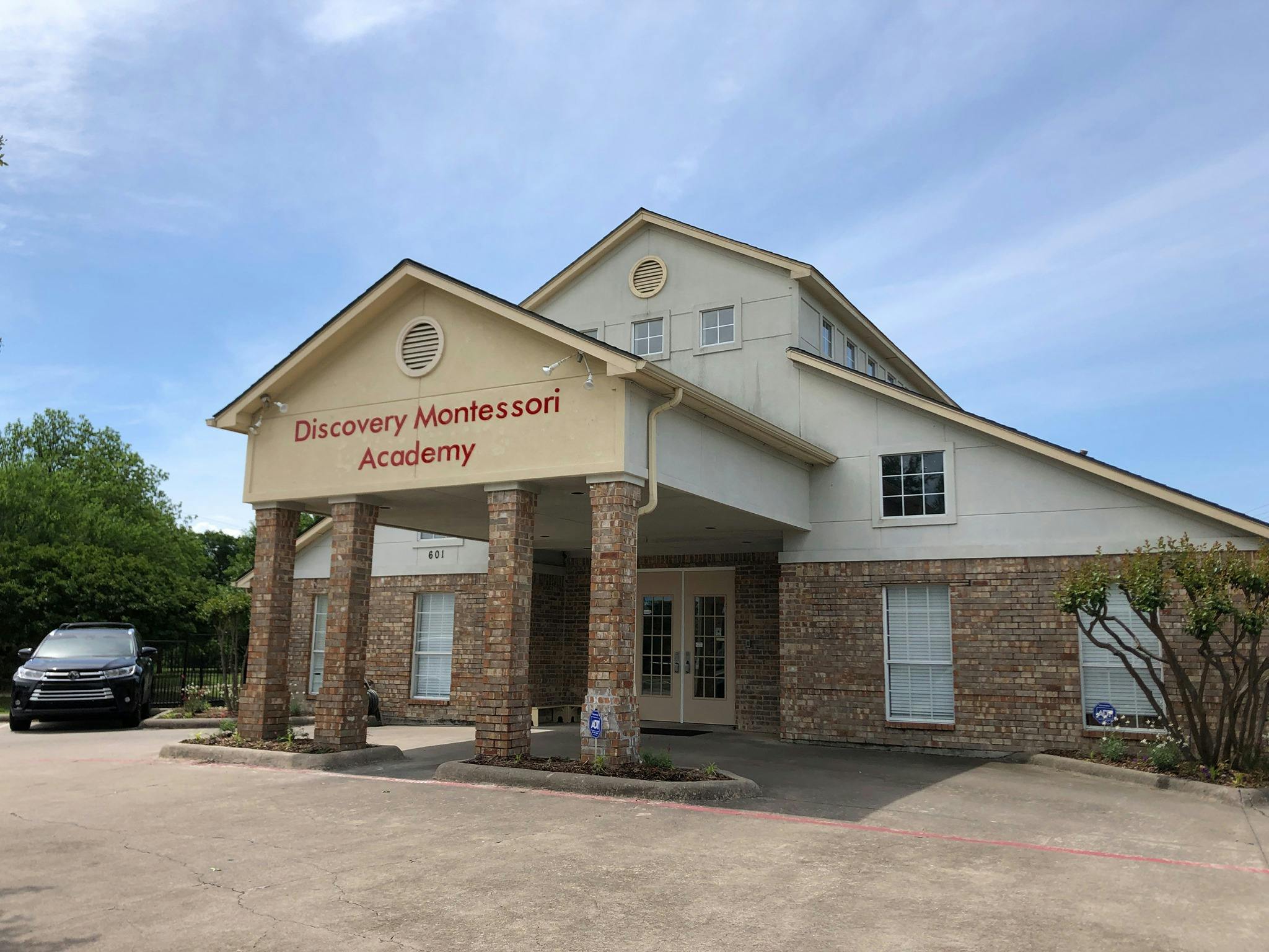 Discovery Montessori Academy building exterior with covered entrance
