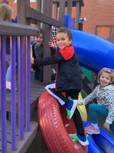 Child climbing on playground equipment
