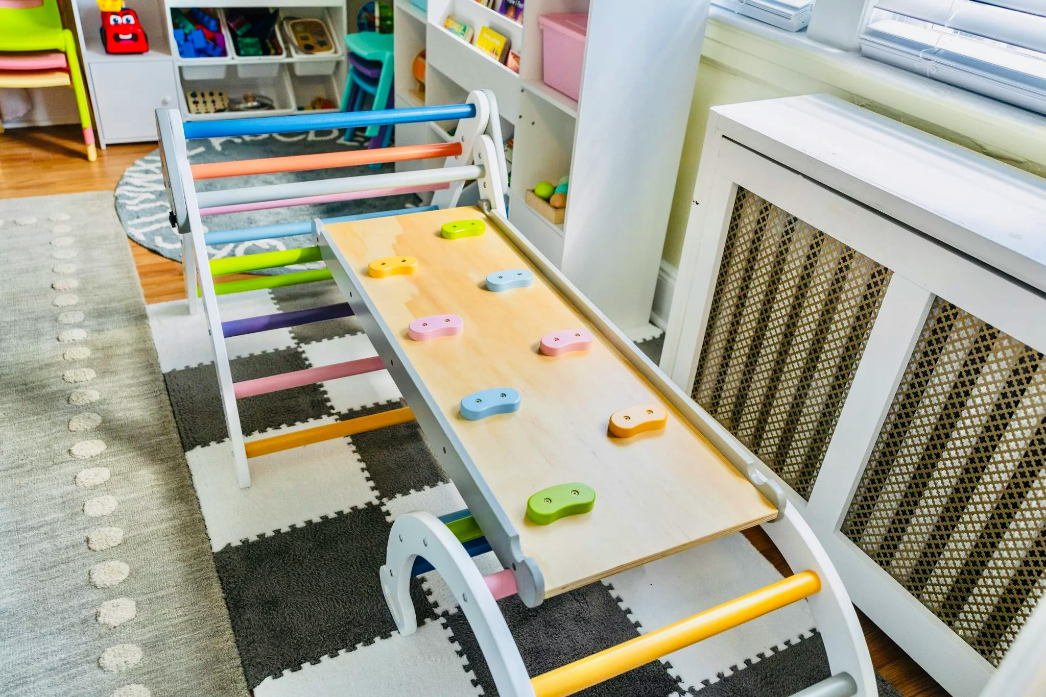 child's indoor climbing structure with ladder and slide