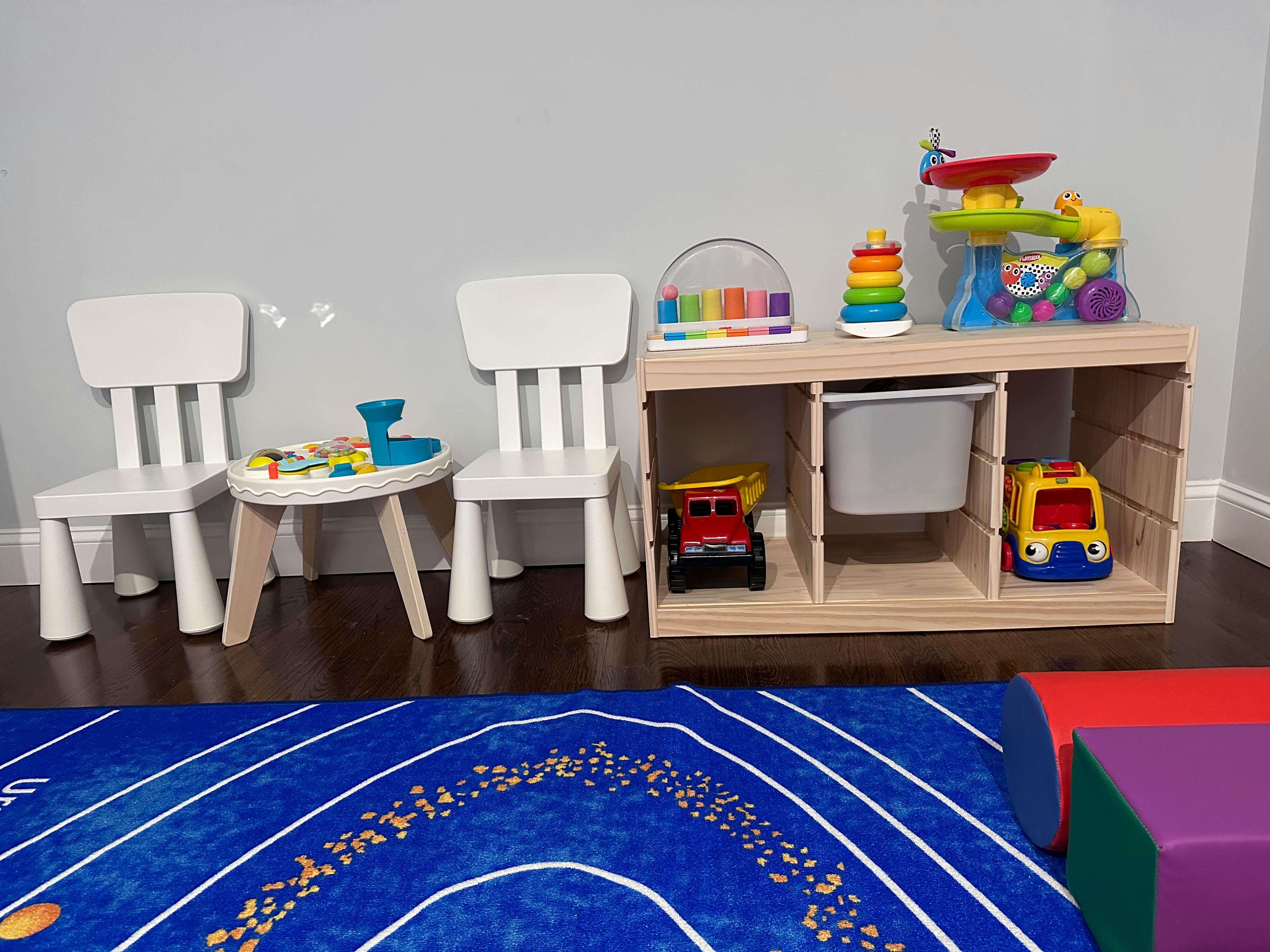 Children's chairs, table, and toy storage unit with toys