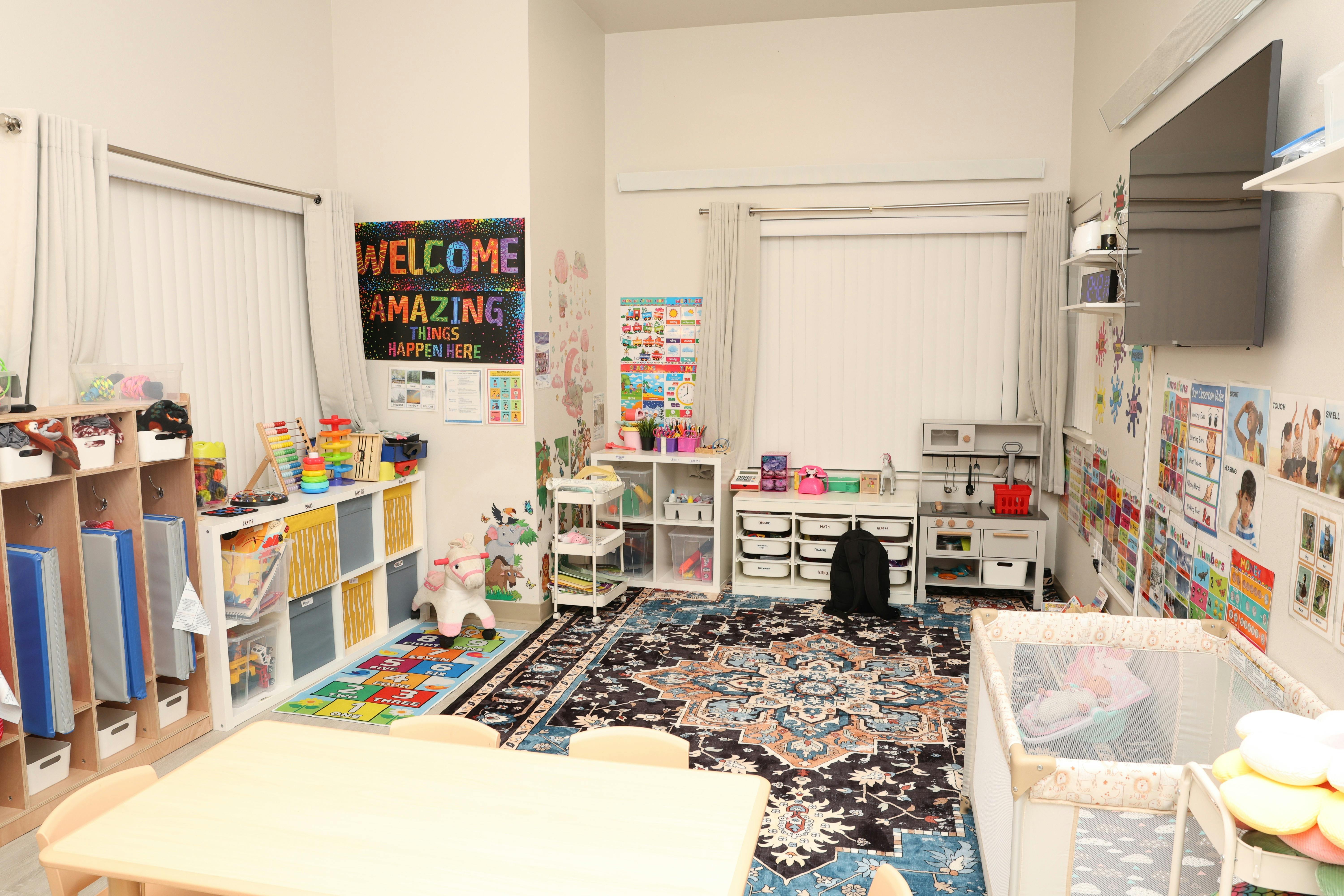 Brightly decorated playroom with shelves for toys and educational posters