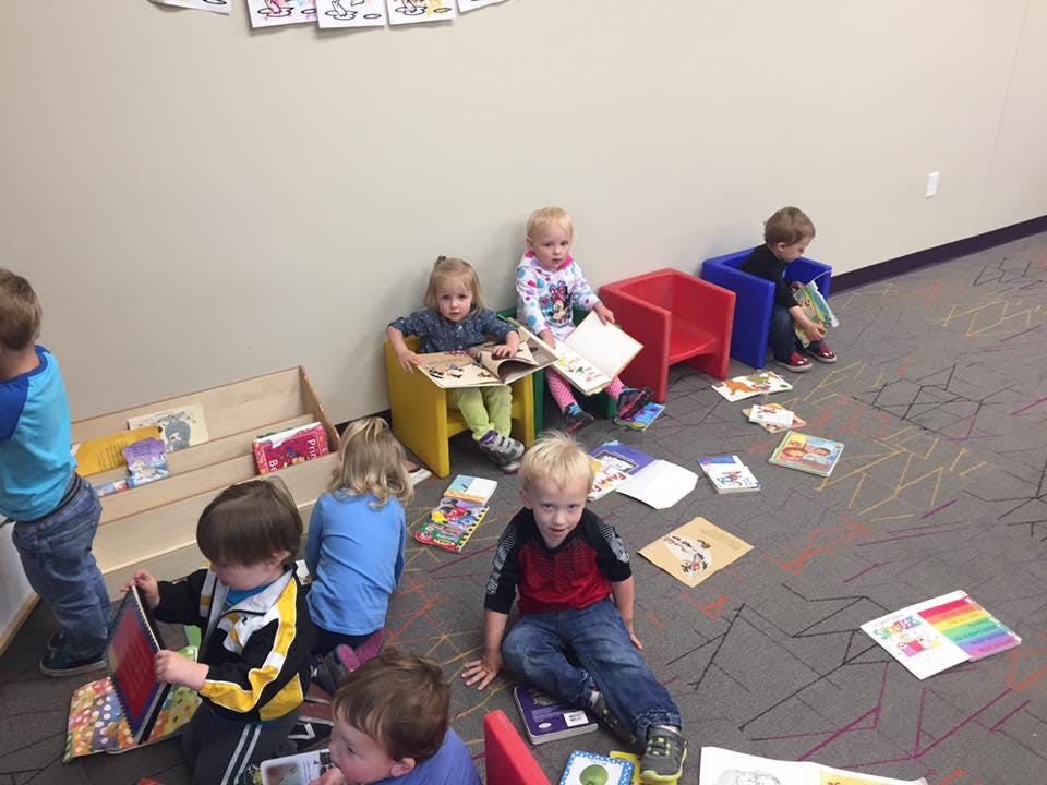 Children reading books in a classroom