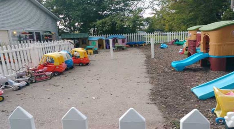 Outdoor playground with slides and ride-on toys