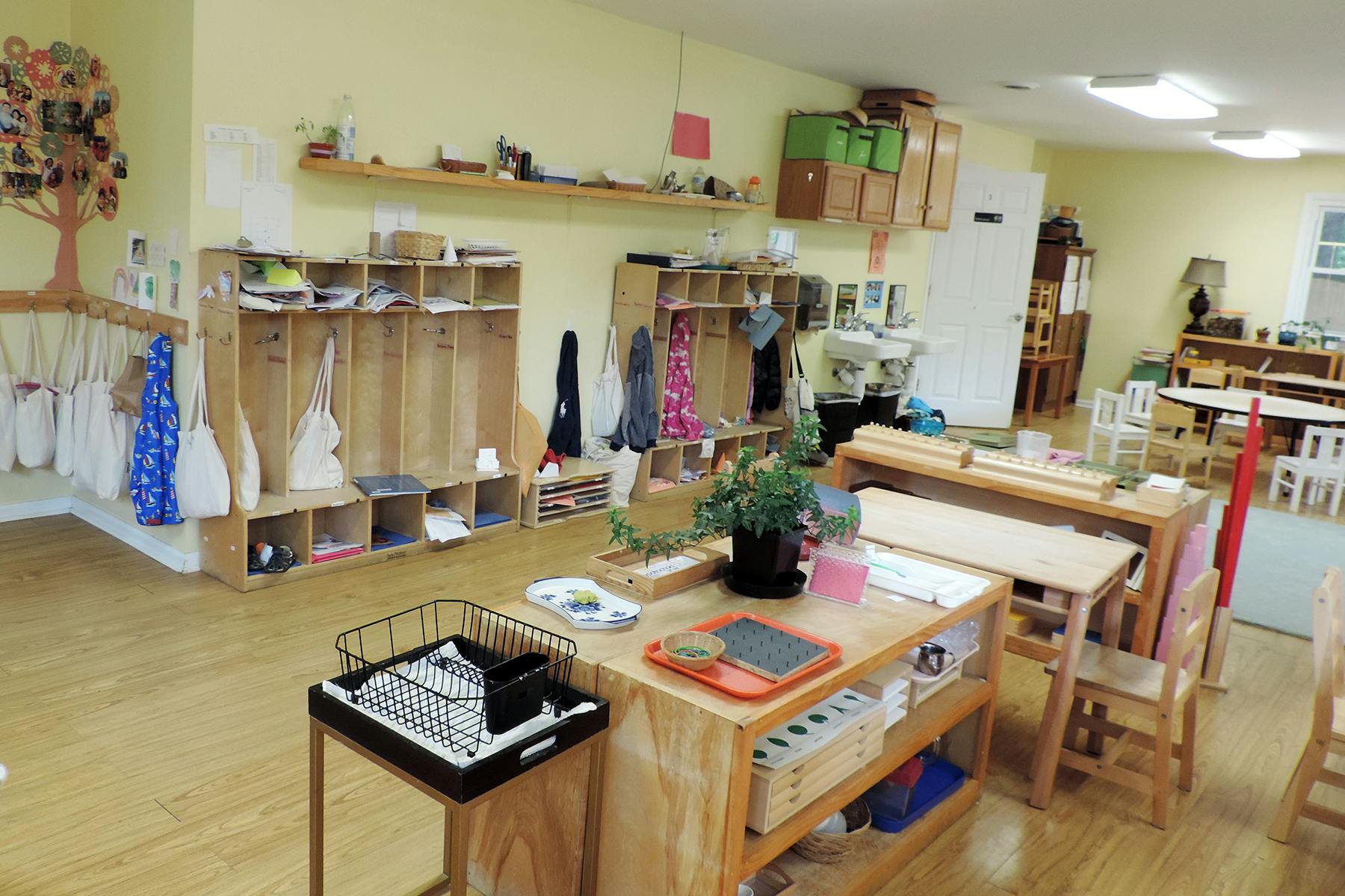 Empty classroom with wooden furniture and cubbies