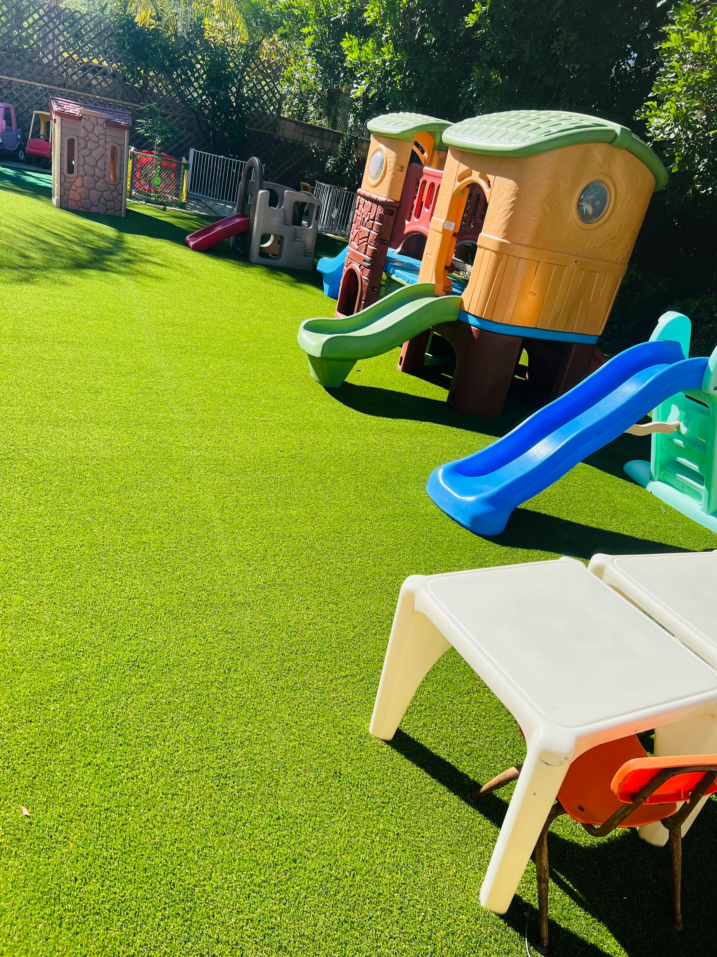 Playground with slides and play structures on artificial grass