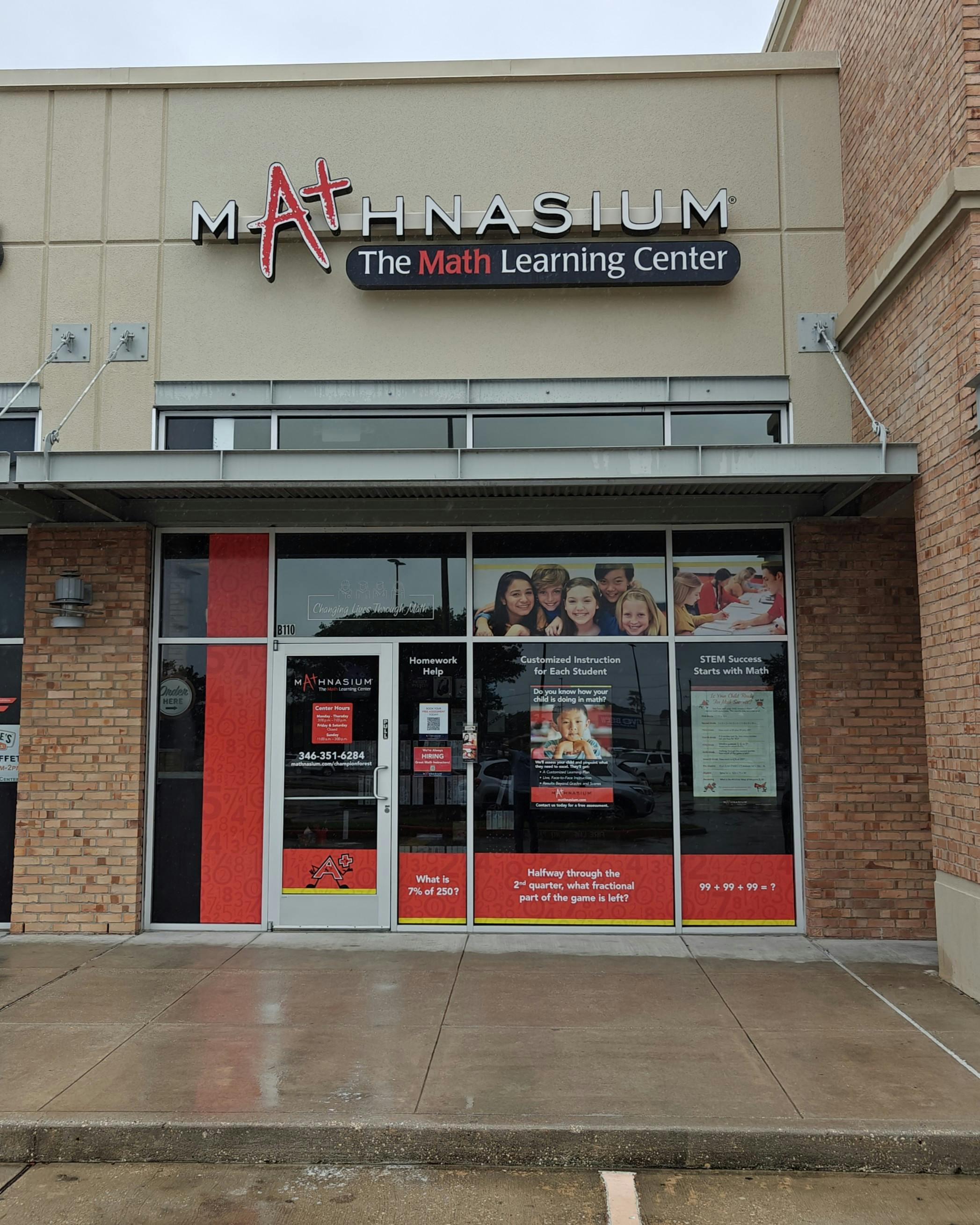 Mathnasium storefront with signs offering math help, customized instruction, and STEM success