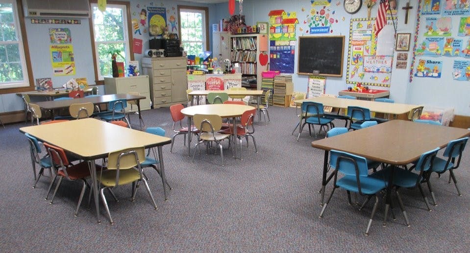 Classroom with multiple tables and chairs