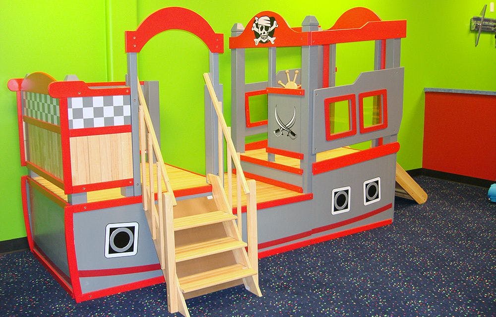 Pirate ship themed play structure with stairs