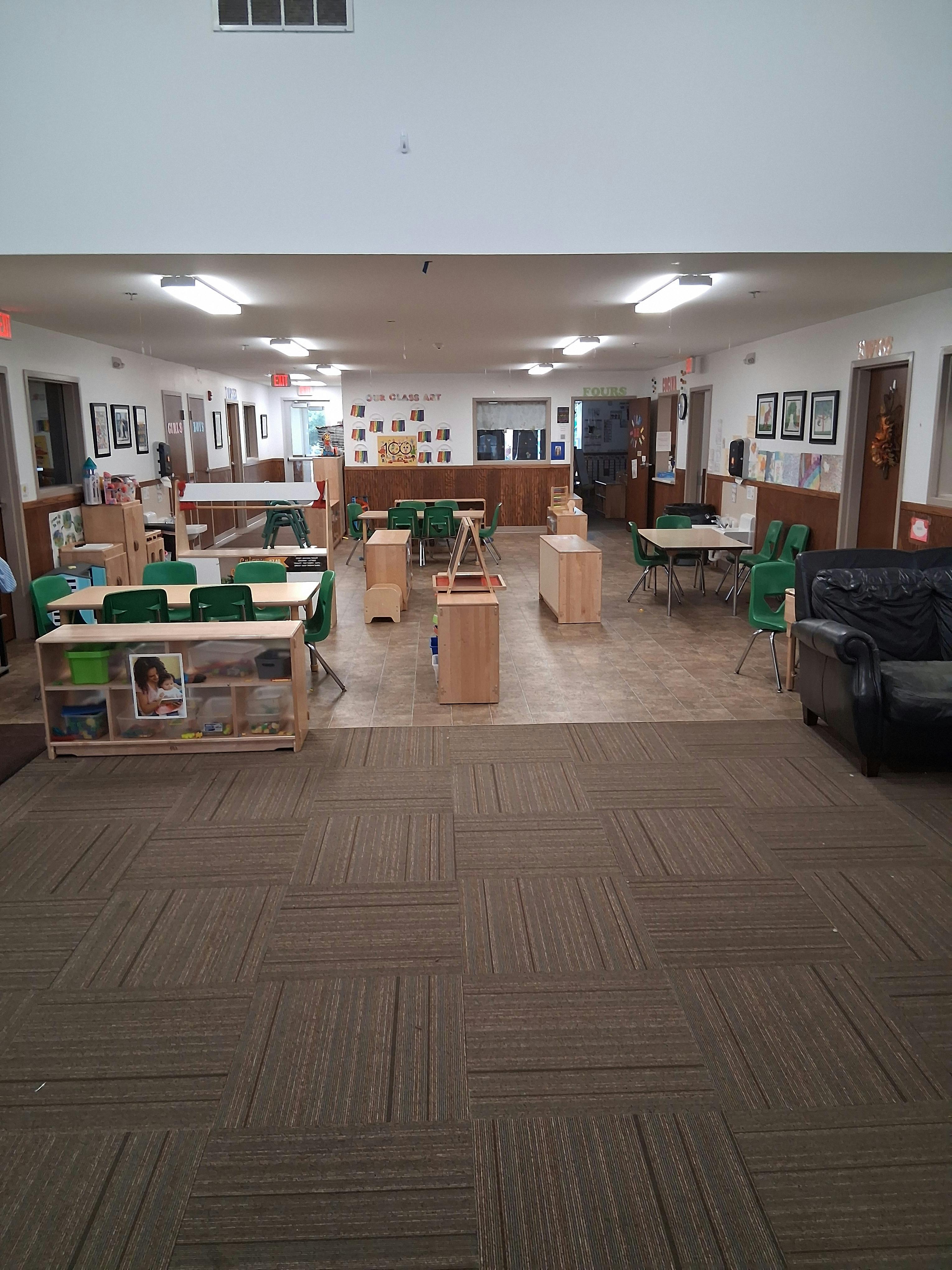 Classroom with tables, chairs, and learning materials