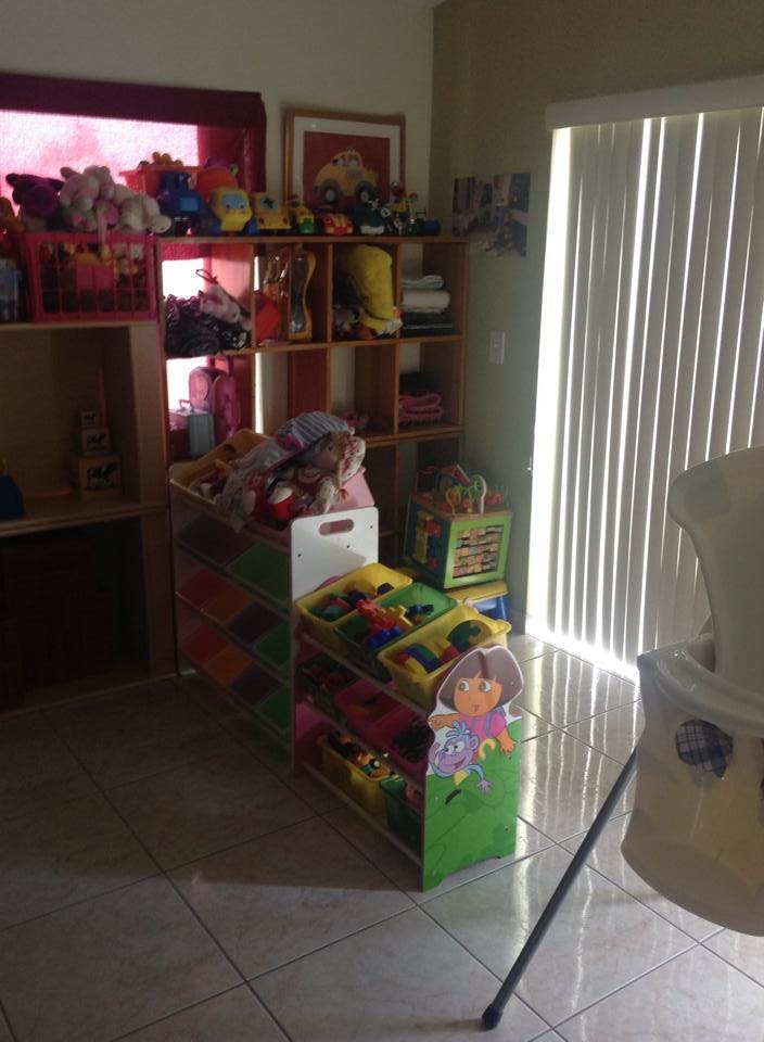 Shelves and toy organizers filled with various items in a room