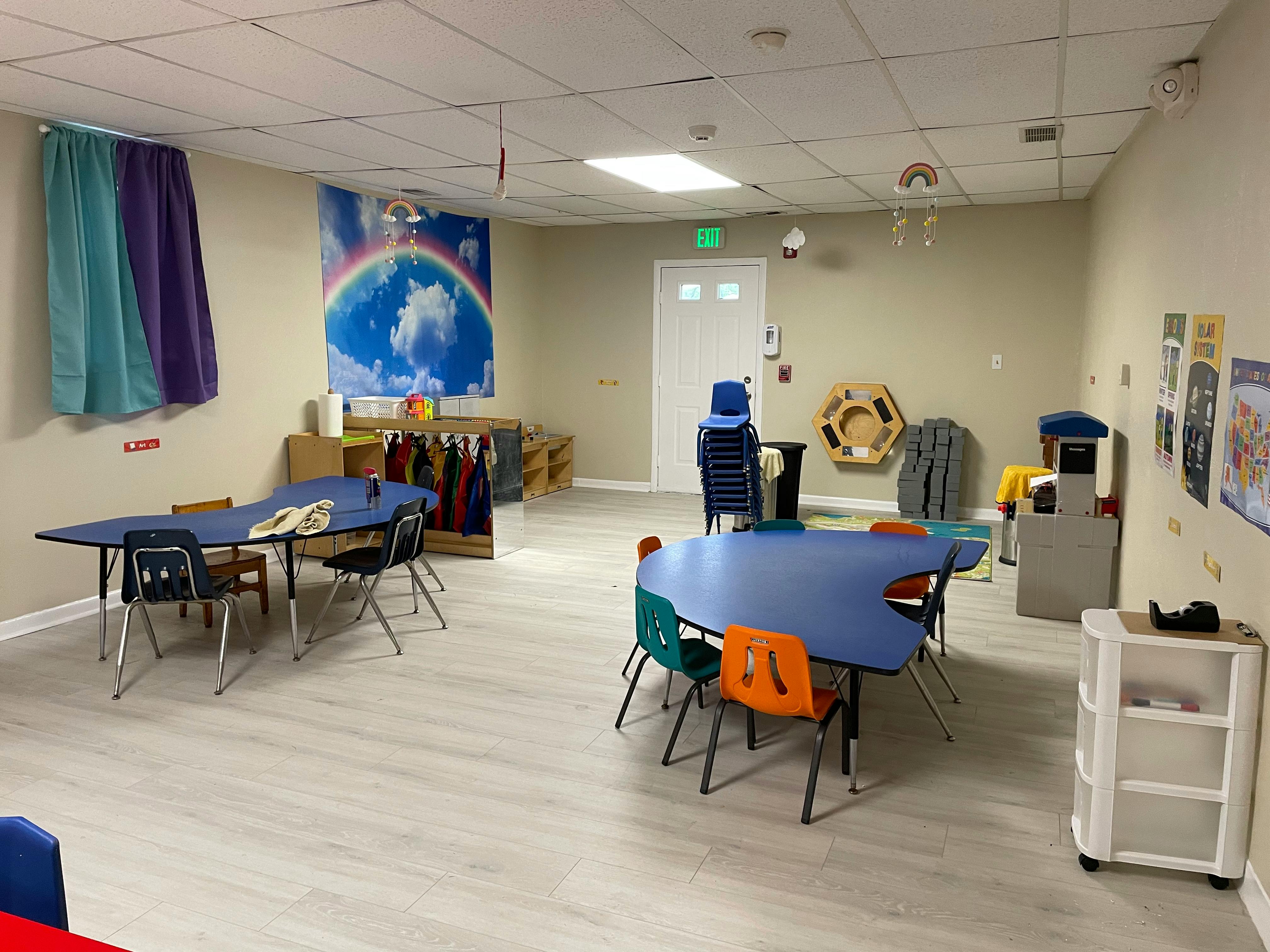 Classroom with blue tables and chairs