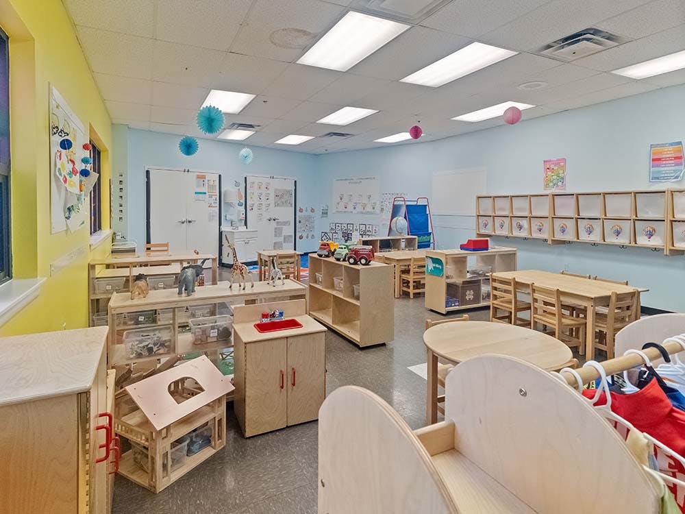 Classroom with child-sized furniture and learning materials