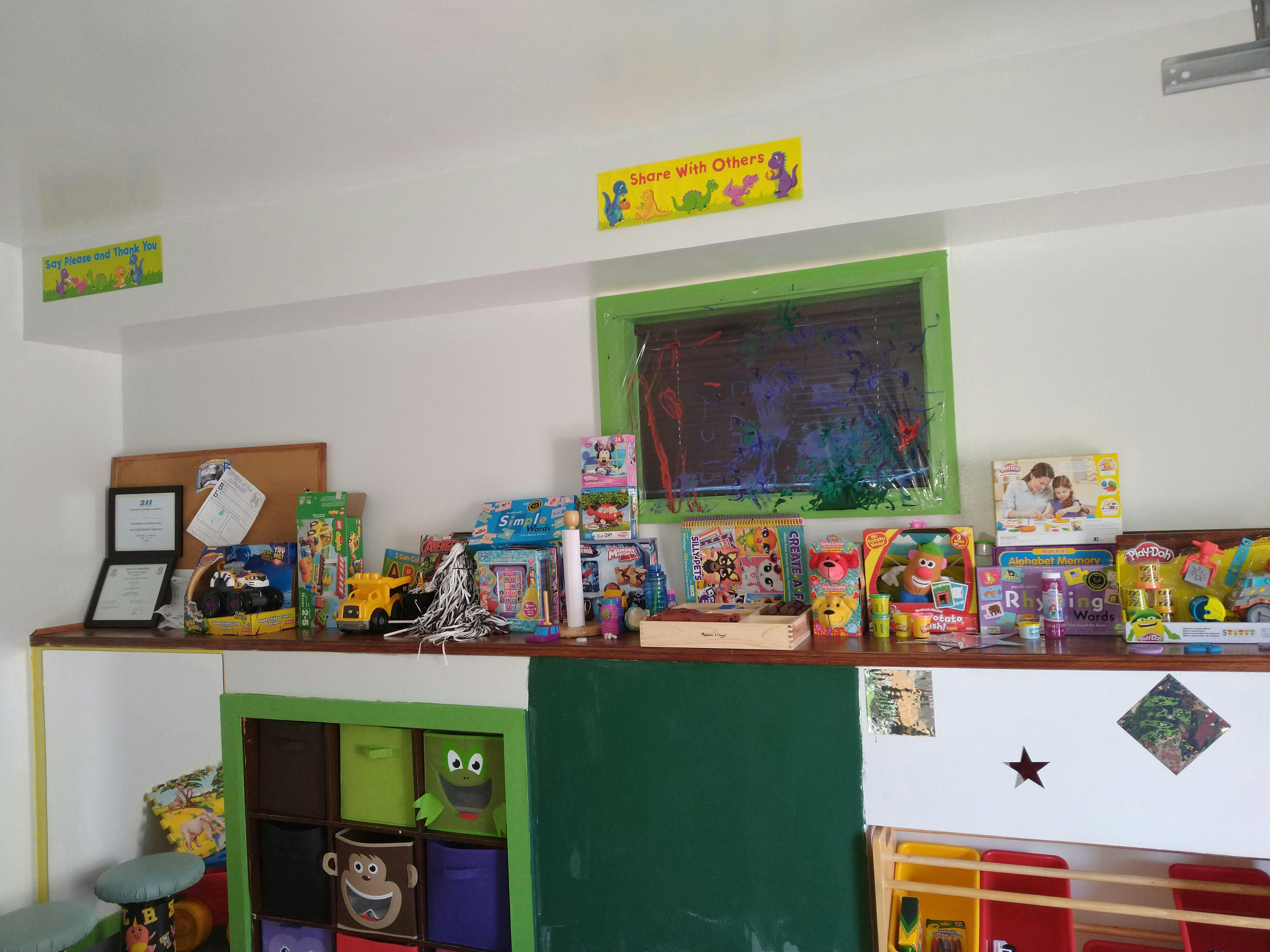 Shelf with various toys and learning materials in a classroom