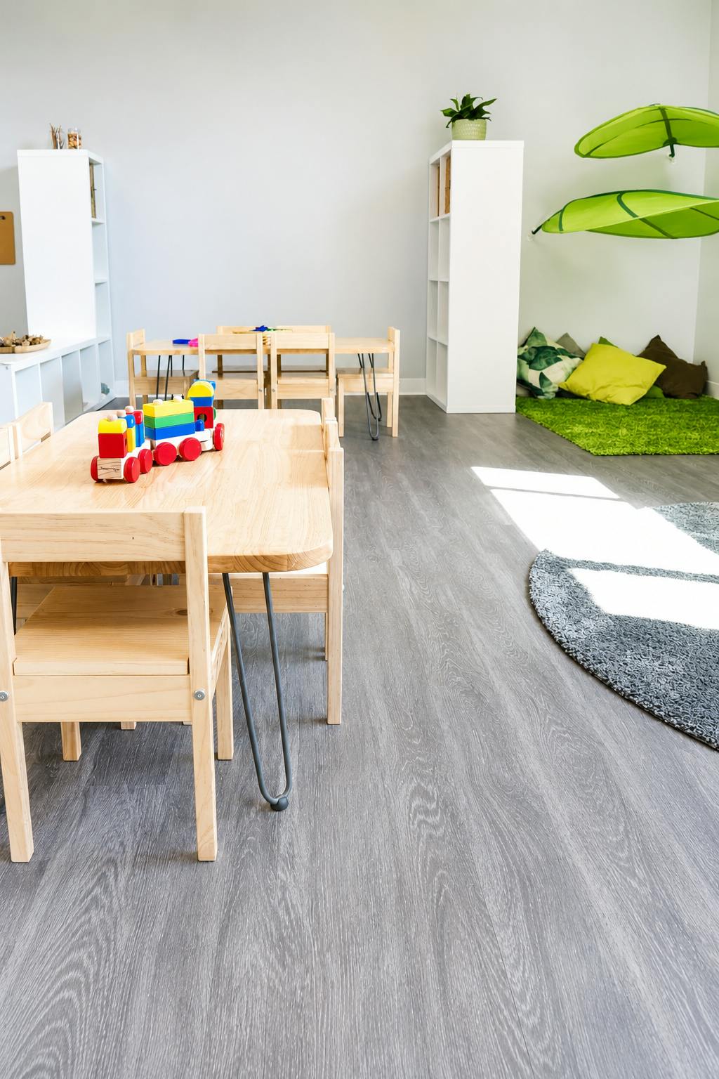 Wooden toy train on a small table in a classroom