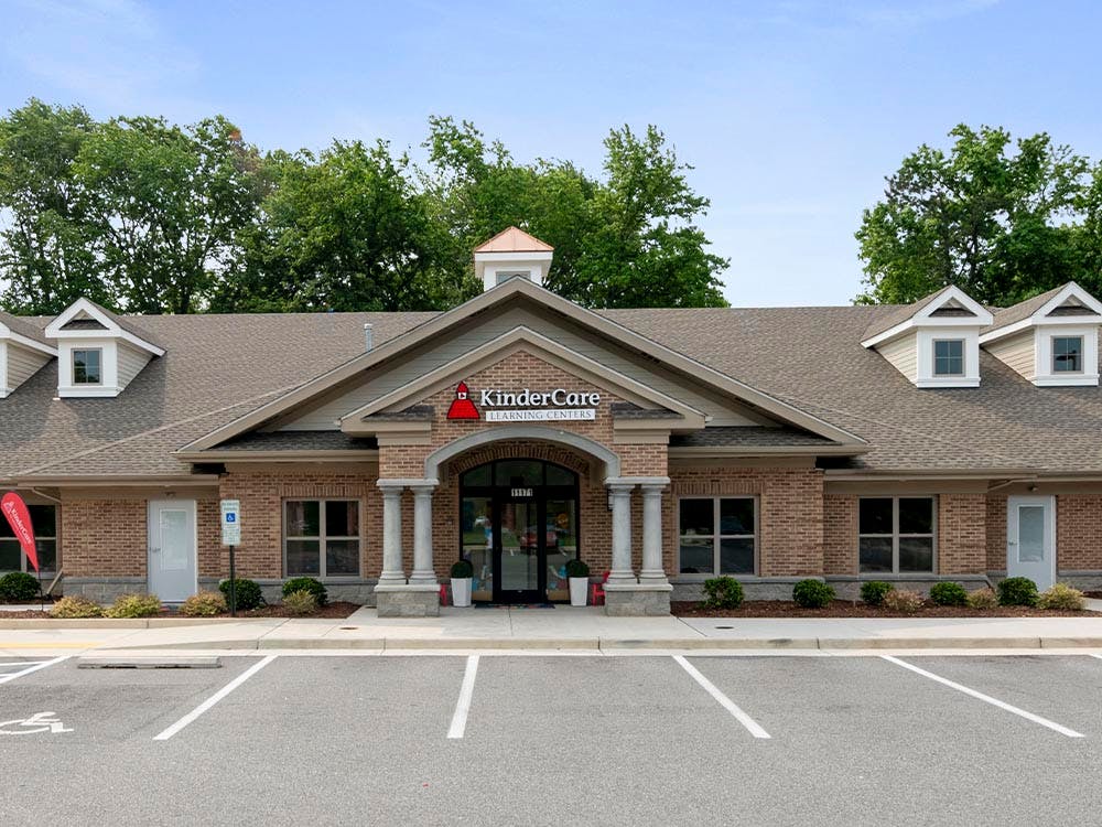 Brick building with a KinderCare Learning Centers sign above the entrance