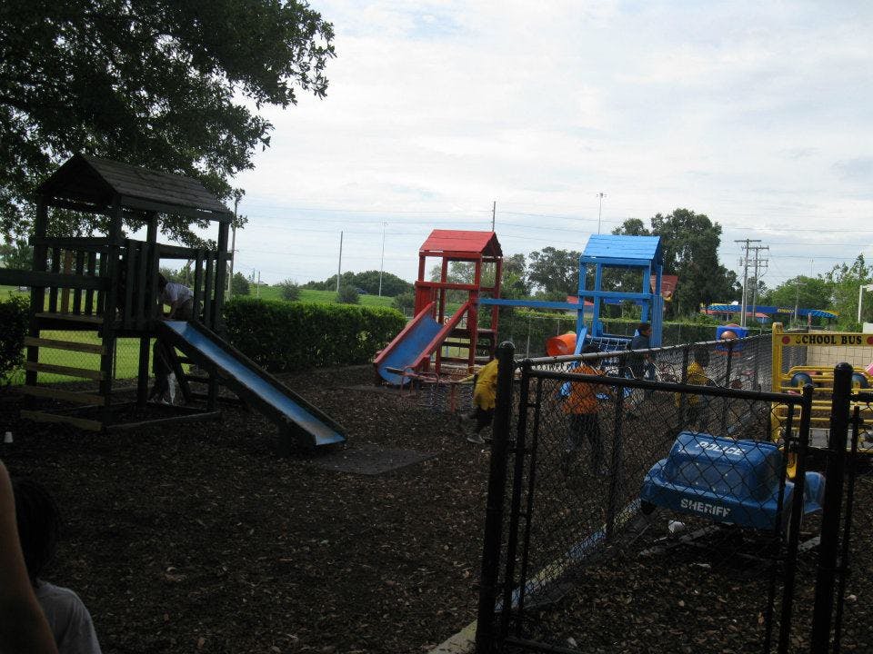 Playground with multiple slides and play structures