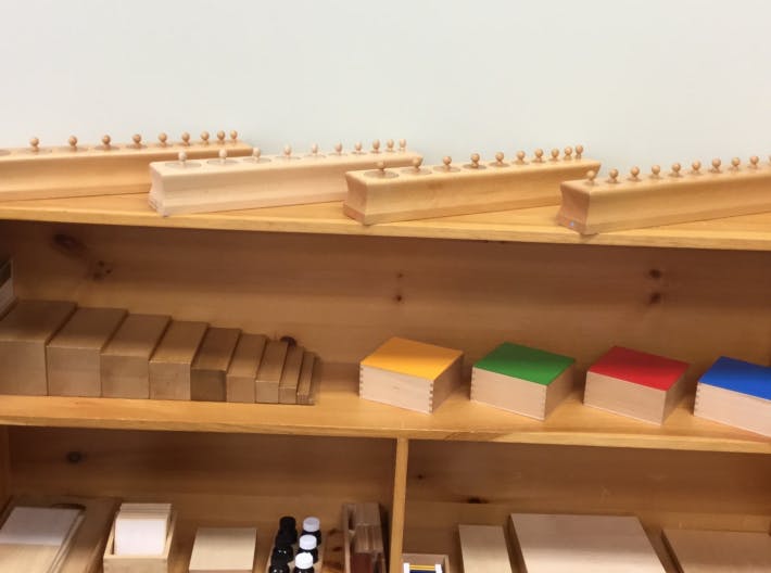 Wooden shelves with educational toys and blocks