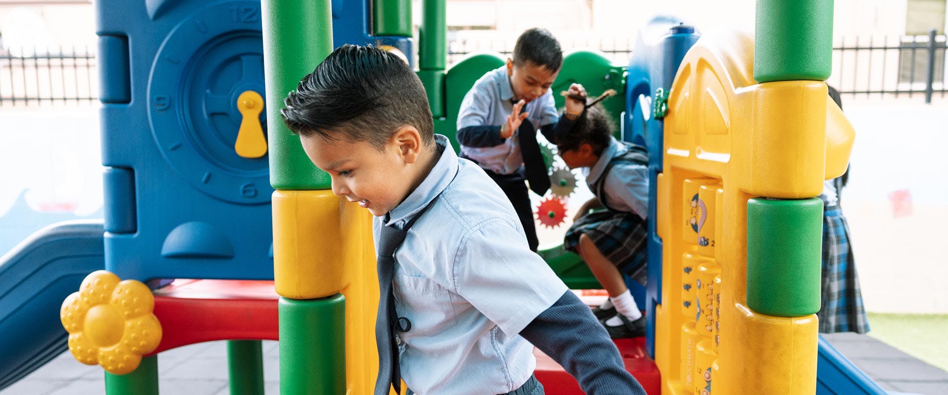 Children playing on a playground structure
