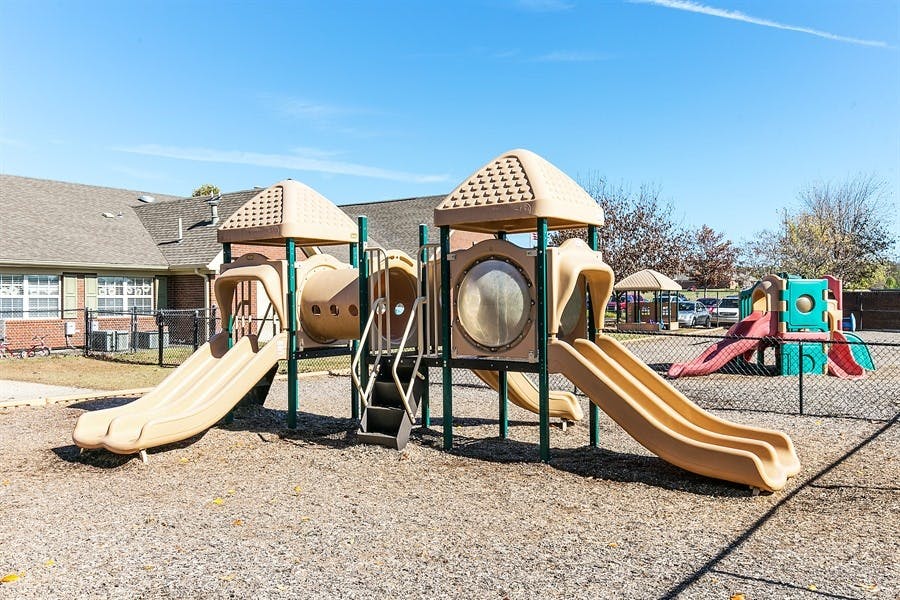 Outdoor playground with slides and climbing structures