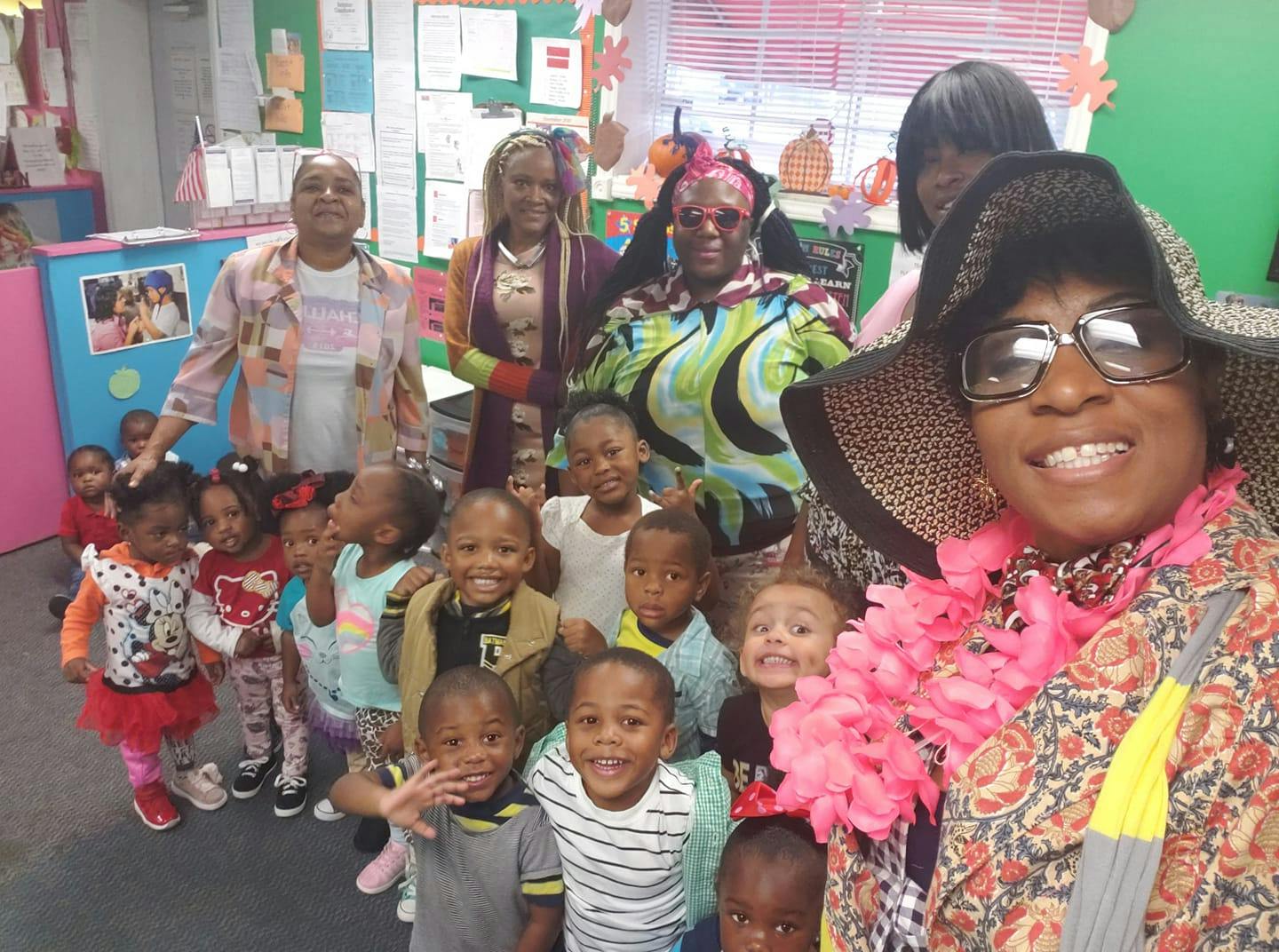 Adults and children posing for a group photo