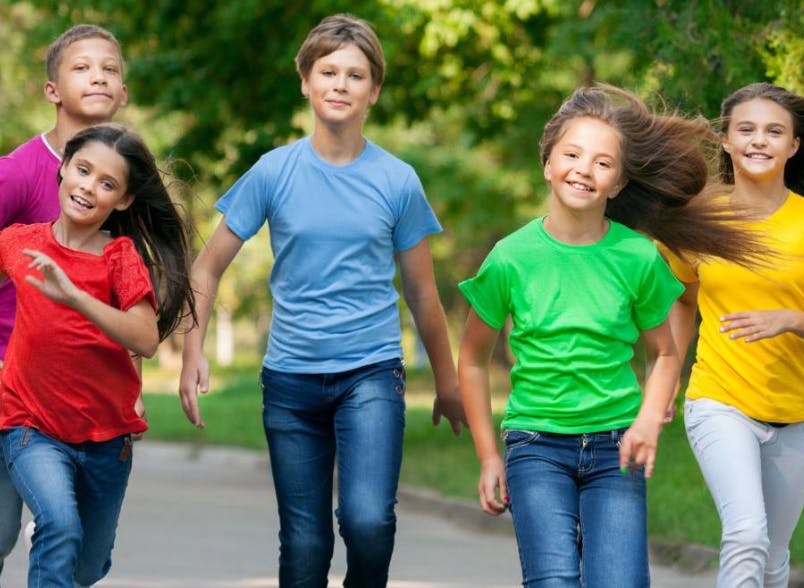Group of children running outdoors