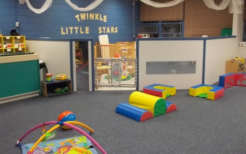 Playroom with soft play shapes, activity mat, and a sign that says Twinkle Little Stars