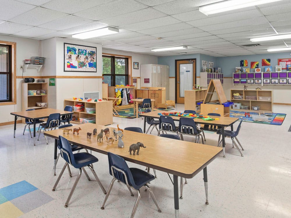 Classroom with tables, chairs, and educational toys