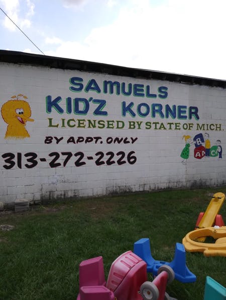 Samuel's Kid'z Korner sign with Big Bird and other characters