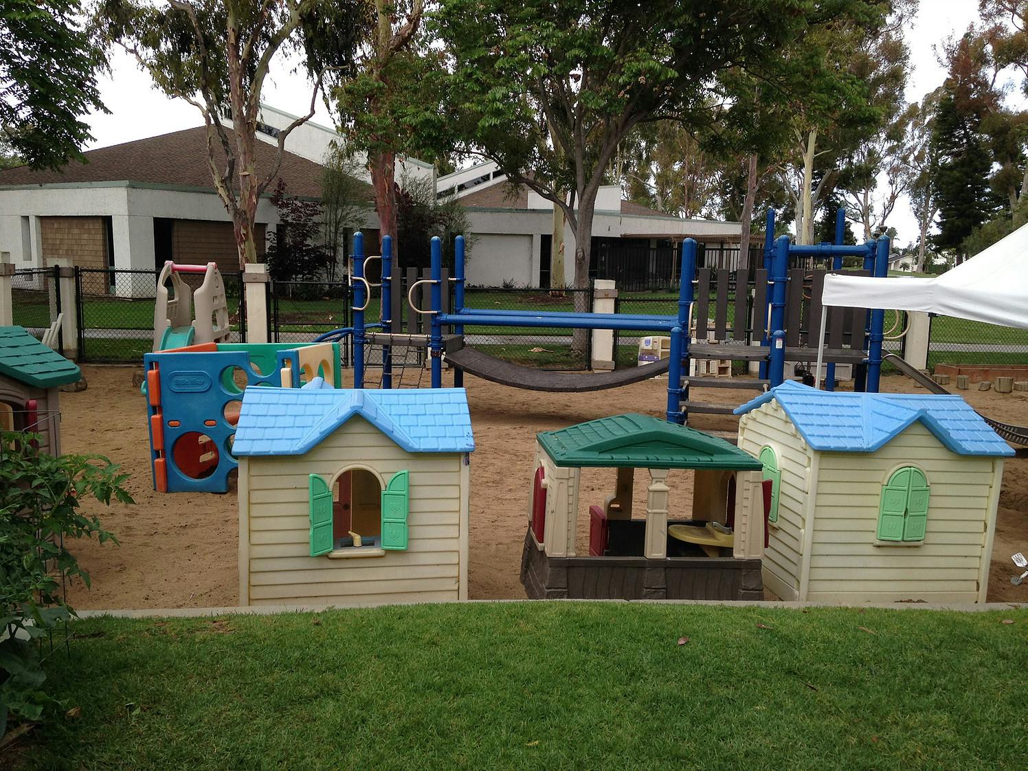 Playground with playhouses and climbing structures