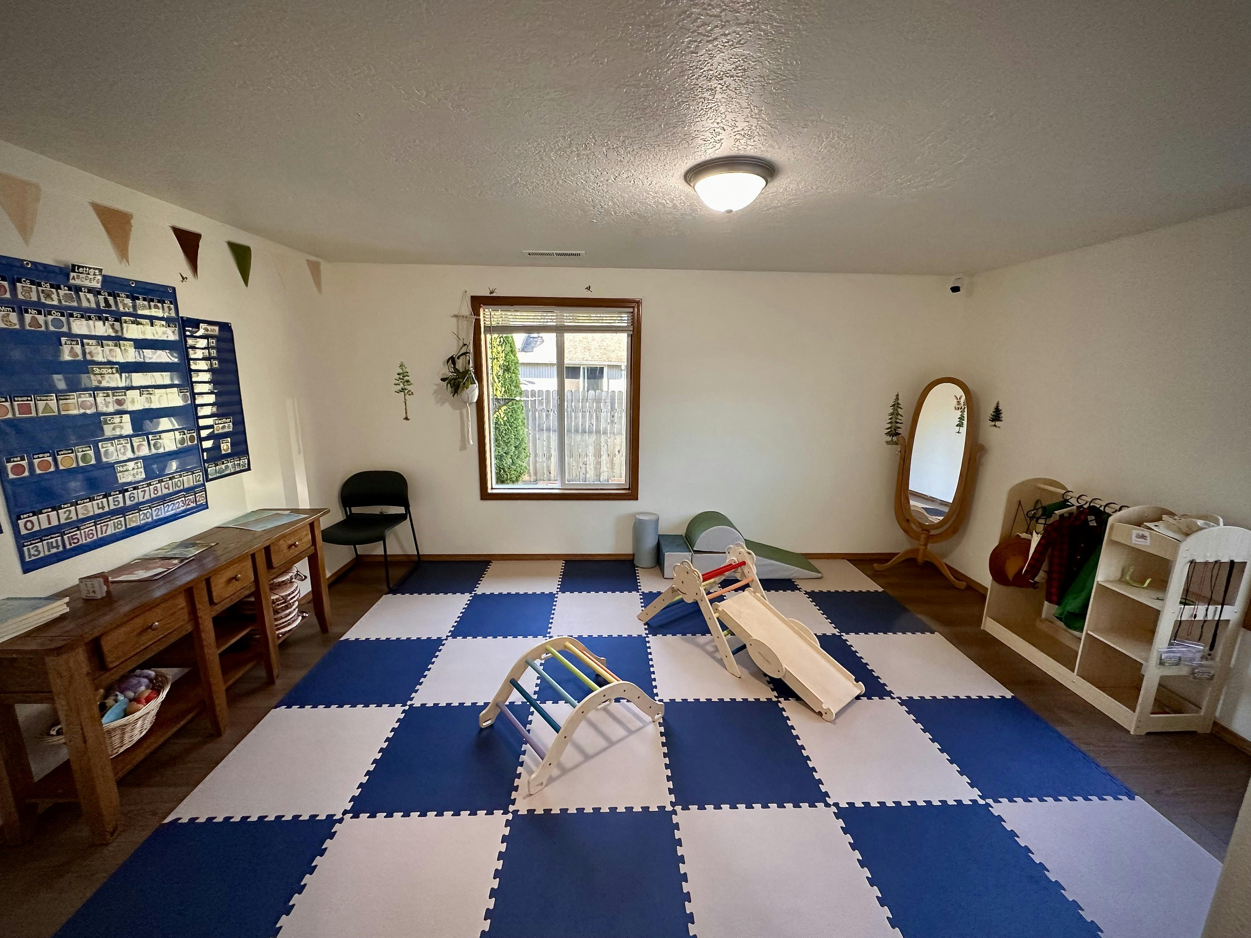 Child playroom with climbing equipment and floor mats