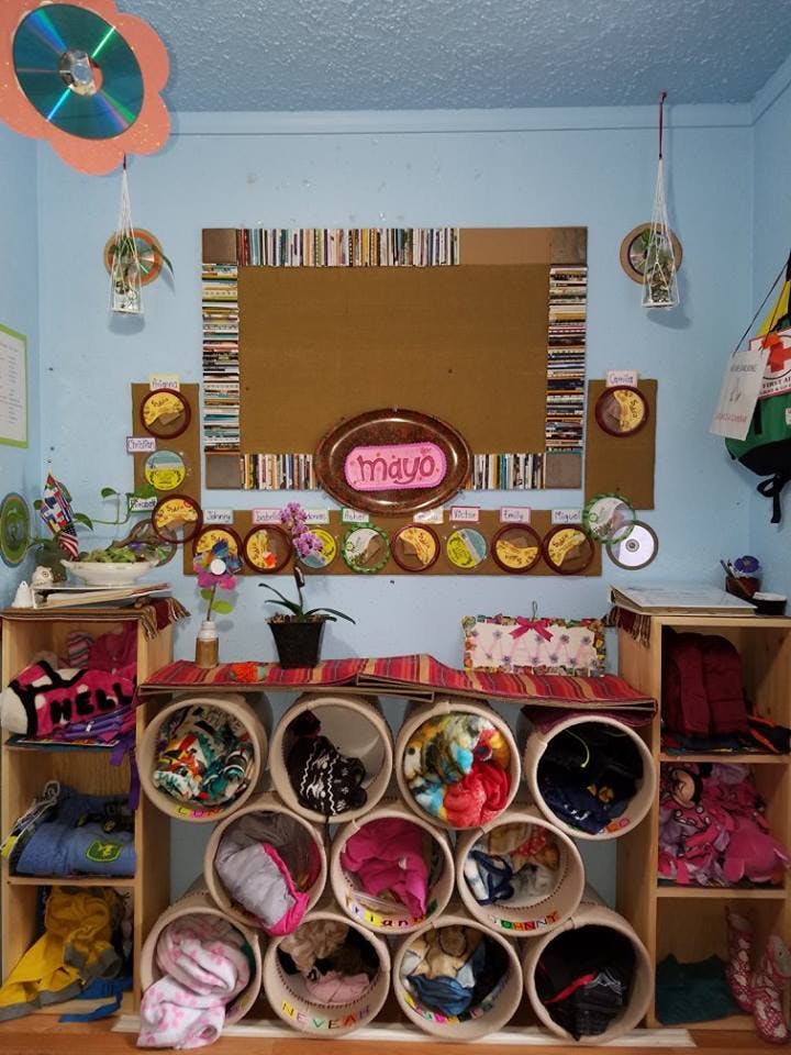 Classroom with a bulletin board and cubbies filled with items
