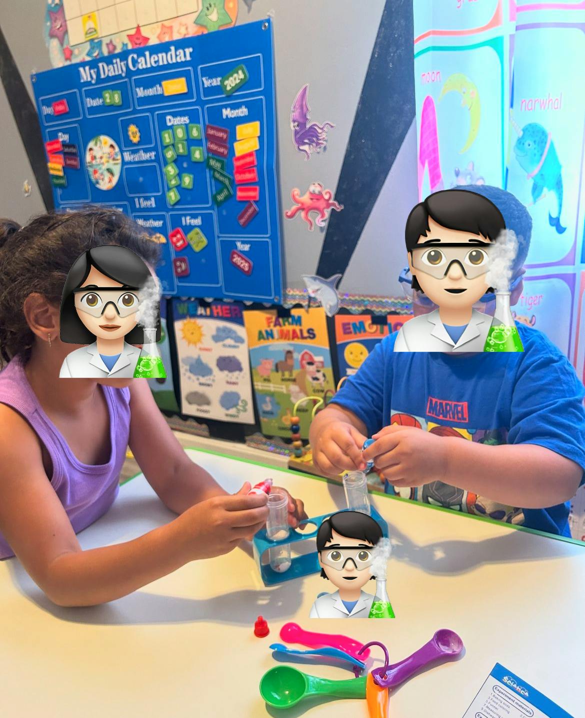 Two children playing with a science kit at a table