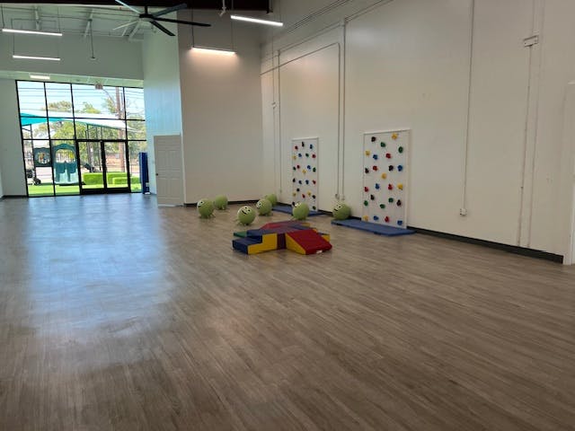 Empty room with climbing walls and soft play equipment