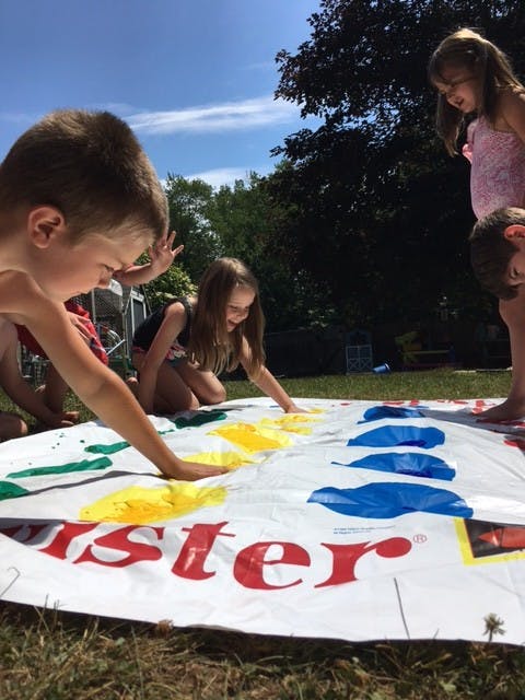Children playing Twister outdoors