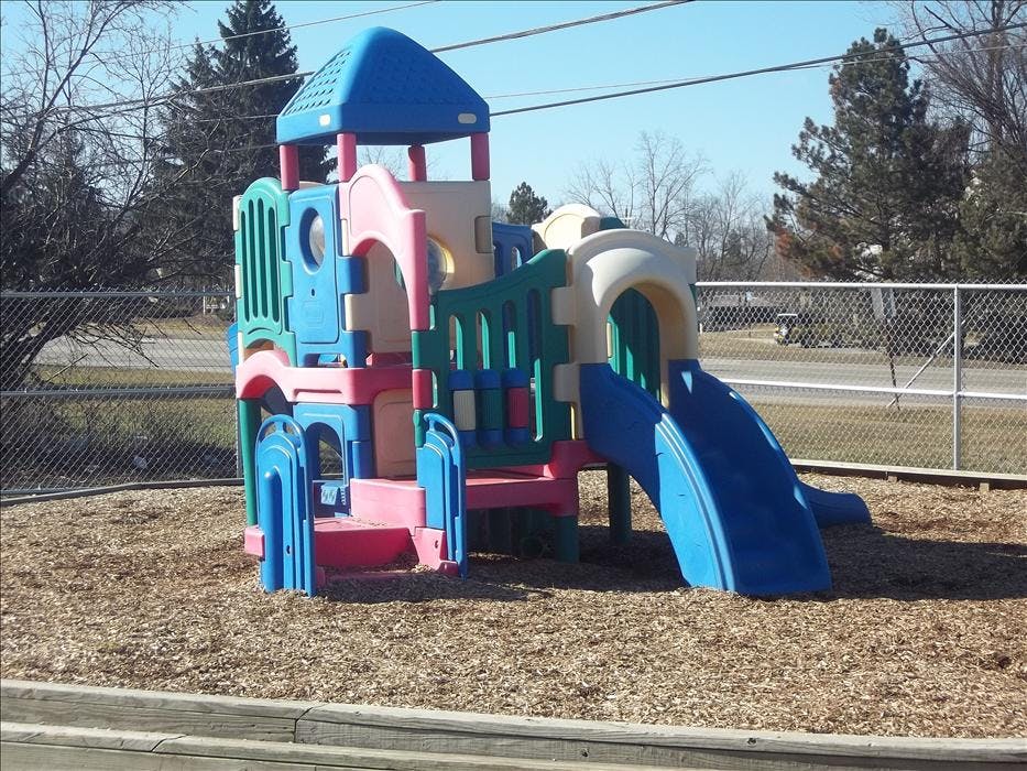 Colorful playground structure on wood chips