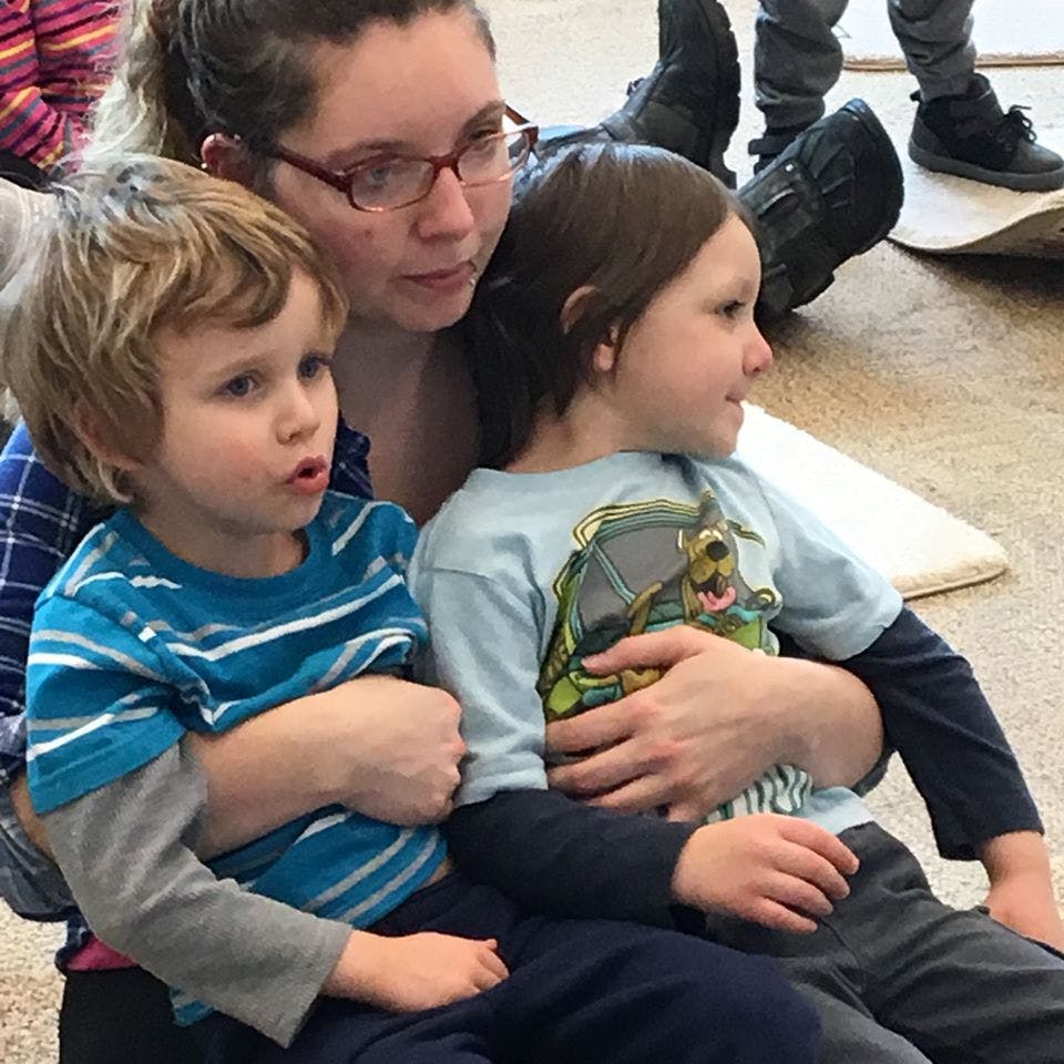 Person with two children sitting together