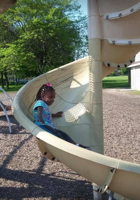 Child on a playground slide
