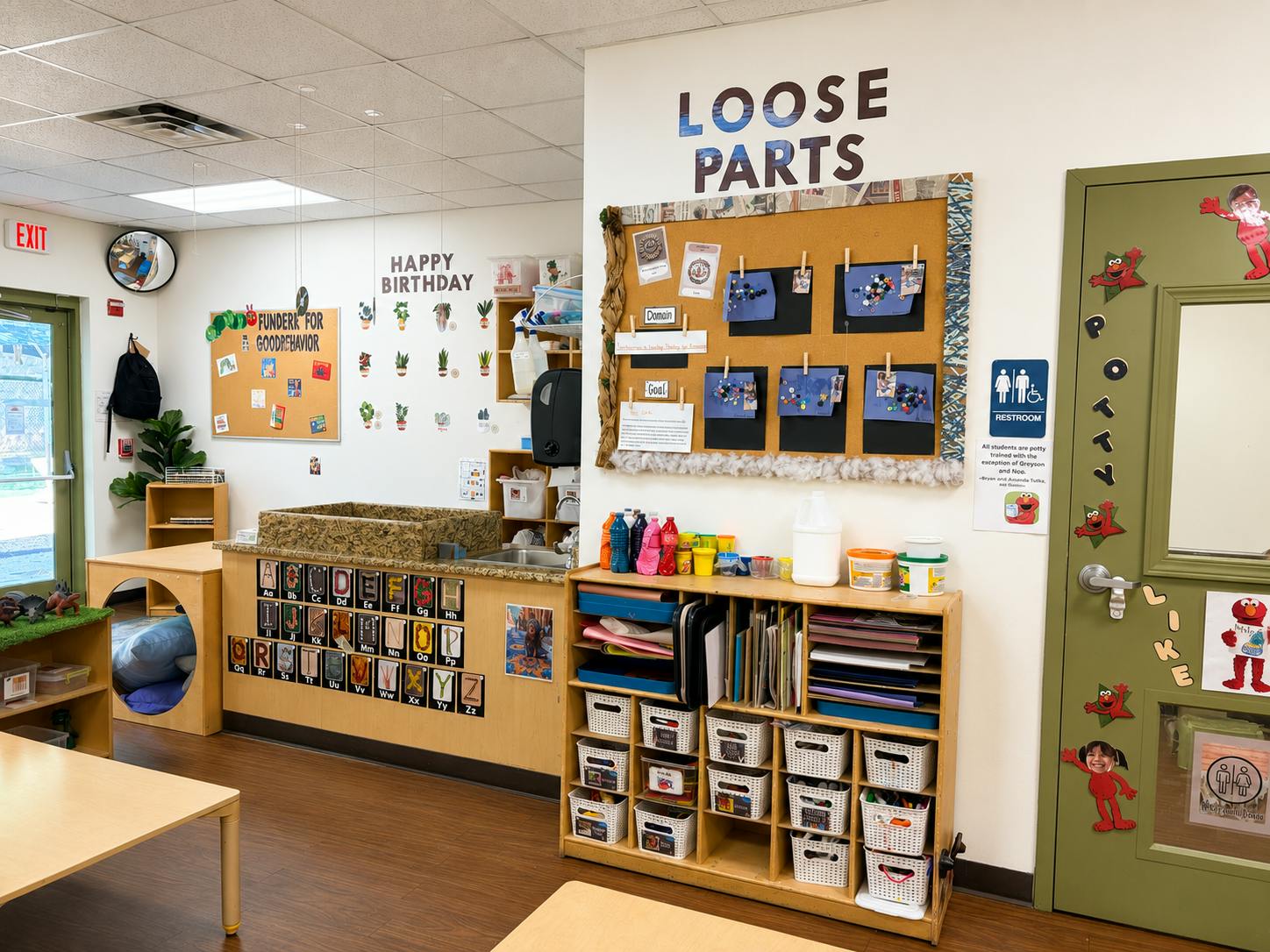 Classroom interior with educational displays and storage shelves