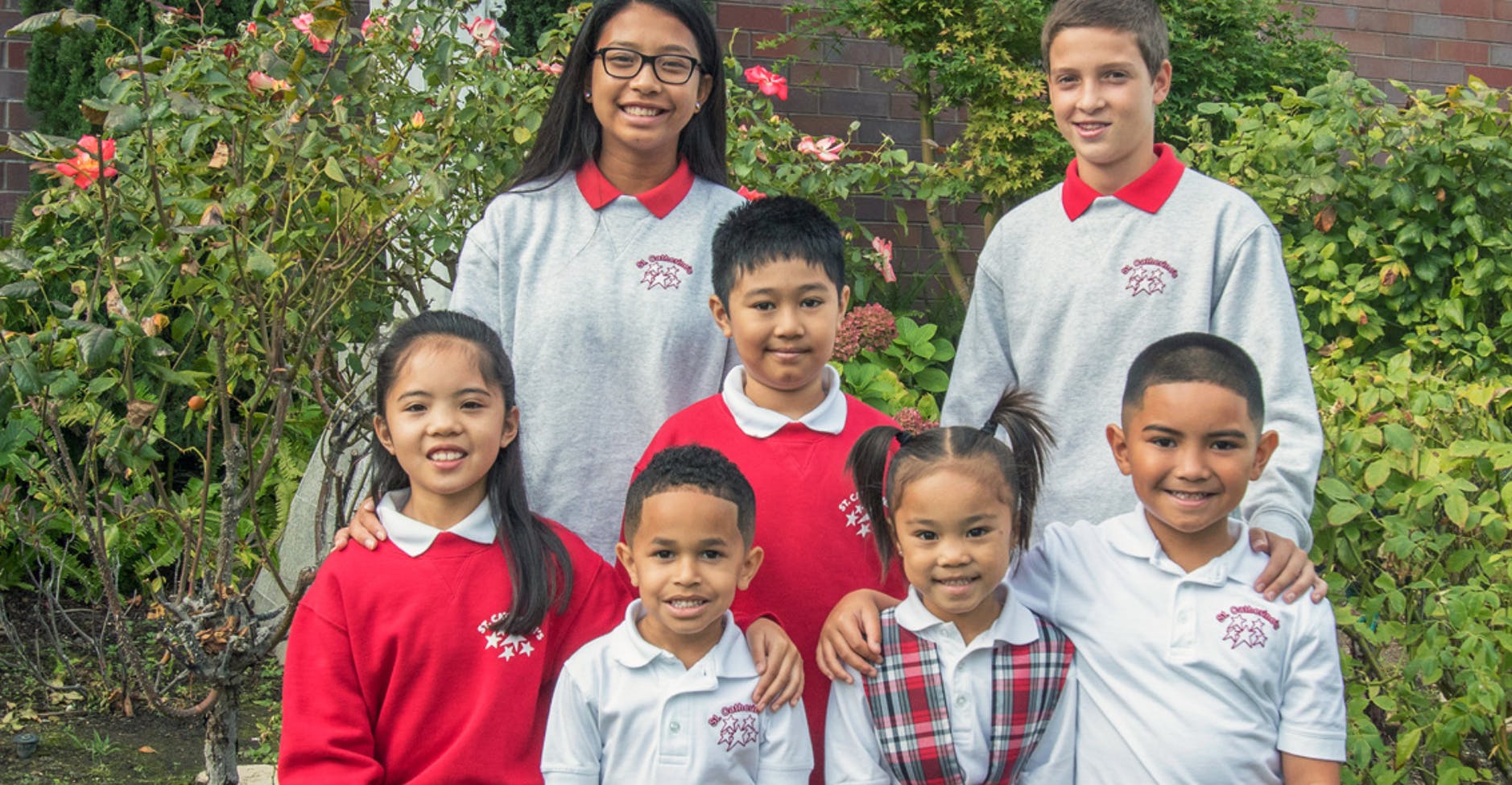 Group of children and teens posing outdoors