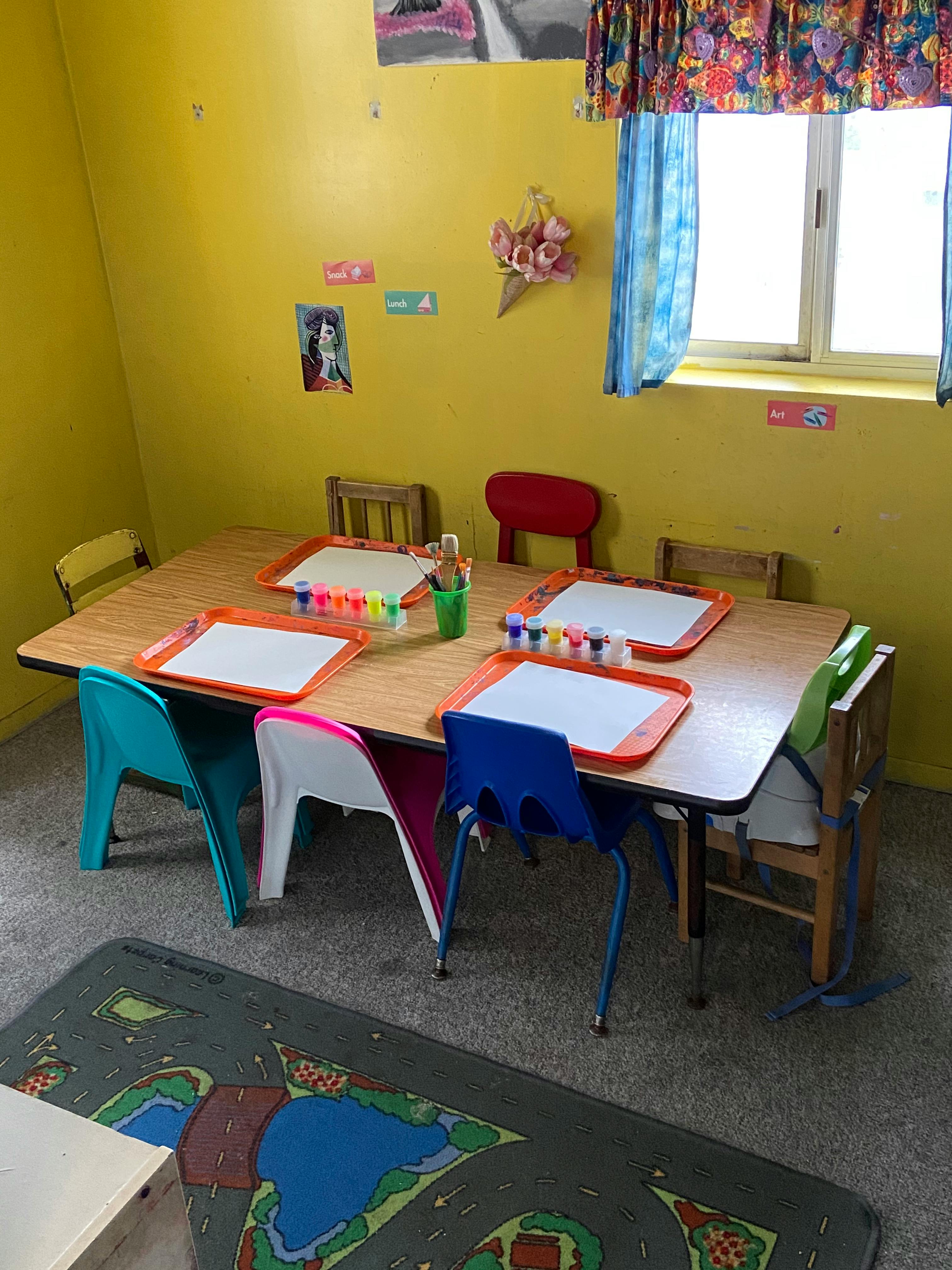 Classroom with a table set up for painting activities